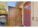 Private entrance with a wooden gate and burgundy front door at 24 Daniel Se St # 12, Atlanta, GA 30312