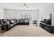 Spacious living room with large sectional sofa and entertainment center at 4192 Integrity Way, Powder Springs, GA 30127