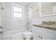 Bathroom with white vanity, granite countertop, and tiled shower at 2631 Godfrey Nw Dr, Atlanta, GA 30318