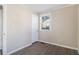 Empty bedroom with a window, wood-look flooring, and neutral-colored walls at 2631 Godfrey Nw Dr, Atlanta, GA 30318