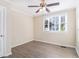 Spacious bedroom with a ceiling fan and large window, providing ample natural light at 2631 Godfrey Nw Dr, Atlanta, GA 30318