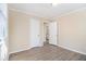 Bedroom featuring wood-look flooring, open doorways, and a view into the bathroom at 2631 Godfrey Nw Dr, Atlanta, GA 30318