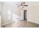 Bright bedroom with wood-look flooring and ceiling fan at 2631 Godfrey Nw Dr, Atlanta, GA 30318