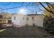 Backyard view of home with deck, lawn, and trees with sun shining through at 2631 Godfrey Nw Dr, Atlanta, GA 30318