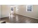 Bright living room with large windows and wood-look flooring at 2631 Godfrey Nw Dr, Atlanta, GA 30318