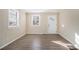 Spacious living area with wood-look flooring and an abundance of natural light at 2631 Godfrey Nw Dr, Atlanta, GA 30318