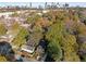 Aerial view showcasing home's location in a wooded area with city skyline in the distance at 60 Newcastle Sw St, Atlanta, GA 30314