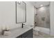 Modern bathroom with gray tile shower and a vanity with quartz countertop at 60 Newcastle Sw St, Atlanta, GA 30314