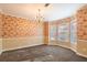 Formal dining room with bay window and floral wallpaper at 3090 Kaley Nw Dr, Kennesaw, GA 30152