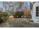 Simple concrete patio in backyard with wooded view at 3090 Kaley Nw Dr, Kennesaw, GA 30152