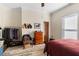 Bedroom with queen bed, dresser, and clothes rack at 1050 Boulevard Ne Dr, Atlanta, GA 30317