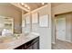 Double vanity bathroom with dark brown cabinets and a large mirror at 1257 Park Pass Way, Suwanee, GA 30024