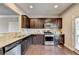 Modern kitchen with stainless steel appliances and granite countertops at 1257 Park Pass Way, Suwanee, GA 30024