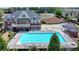 Community pool with adjacent clubhouse at 1257 Park Pass Way, Suwanee, GA 30024