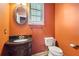 Powder room with dark wood vanity and granite countertop at 22 Spring Lake Trl, White, GA 30184