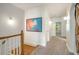 Upstairs hallway with hardwood floors and neutral walls at 2682 Colgan Se Ct, Atlanta, GA 30317