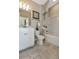 Full bathroom with single vanity and tub shower combo at 5763 Grapewood St, Hoschton, GA 30548