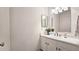 Bathroom with single sink vanity and mirror at 143 Lablanc Way, Atlanta, GA 30327