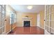 Living room with fireplace and French doors at 143 Lablanc Way, Atlanta, GA 30327