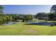 Tennis courts nestled near a lake at 143 Lablanc Way, Atlanta, GA 30327