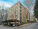 Modern condo building with parking and mature trees at 2769 Peachtree Ne Rd # 10, Atlanta, GA 30305