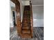 Wooden staircase leading to the upper level of the home at 125 Toccoa Rd, Carrollton, GA 30116