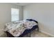 Cozy bedroom with a double bed and a window with blinds at 510 Jefferson Chase St, Atlanta, GA 30354