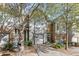 Two-story townhome with gray siding, stone accents, and a two-car garage at 510 Jefferson Chase St, Atlanta, GA 30354