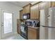 Galley kitchen with granite countertops and dark brown cabinets at 510 Jefferson Chase St, Atlanta, GA 30354