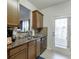 Galley kitchen with granite countertops and dark brown cabinets at 510 Jefferson Chase St, Atlanta, GA 30354