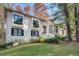 White brick house with black windows and landscaping at 2305 Sherbrooke Ne Dr, Atlanta, GA 30345