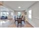 Bright dining room with hardwood floors and view into living room at 1729 Creveis Rd, Austell, GA 30168