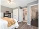 Bedroom with ensuite bathroom, wood-look floors, and ceiling fan at 2541 Kickerillo Se Way, Atlanta, GA 30316