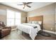 Bedroom with a king-size bed, wooden headboard, and a cozy armchair at 2541 Kickerillo Se Way, Atlanta, GA 30316