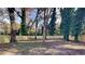 Private backyard with wooden fence and mature trees at 1864 Pinedale Pl, Decatur, GA 30032