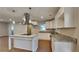 Kitchen island with granite countertop and stainless steel range hood at 1864 Pinedale Pl, Decatur, GA 30032
