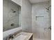 Clean and modern shower with marble tile and a rain shower head at 1864 Pinedale Pl, Decatur, GA 30032