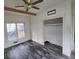 Bright bedroom with window, closet, and ceiling fan at 43 Gammon Se Ave, Atlanta, GA 30315