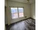Spacious bedroom with large window and new flooring at 43 Gammon Se Ave, Atlanta, GA 30315