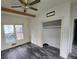 Bright bedroom with window, closet, and ceiling fan at 43 Gammon Se Ave, Atlanta, GA 30315