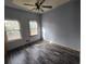 Bright bedroom with two windows, ceiling fan, and laminate flooring at 43 Gammon Se Ave, Atlanta, GA 30315