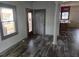 An entryway with grey walls, laminate flooring, and a view into the kitchen at 43 Gammon Se Ave, Atlanta, GA 30315