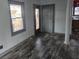 An entryway with grey walls, laminate flooring, and a view into the kitchen at 43 Gammon Se Ave, Atlanta, GA 30315