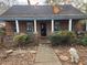 Brick home with covered porch and landscaped yard at 43 Gammon Se Ave, Atlanta, GA 30315