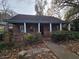 Brick house with covered porch and landscaping at 43 Gammon Se Ave, Atlanta, GA 30315