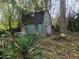 Exterior shed with dark green paint and a Japanese door at 43 Gammon Se Ave, Atlanta, GA 30315