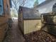 Small exterior shed with light beige siding and dark roof at 43 Gammon Se Ave, Atlanta, GA 30315