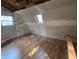 Unfinished loft bedroom with wood floors at 43 Gammon Se Ave, Atlanta, GA 30315