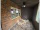 Sunroom with brick walls, tiled floor, and ceiling fan at 43 Gammon Se Ave, Atlanta, GA 30315