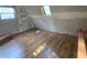 Unfinished upper level room with hardwood floors and window at 43 Gammon Se Ave, Atlanta, GA 30315